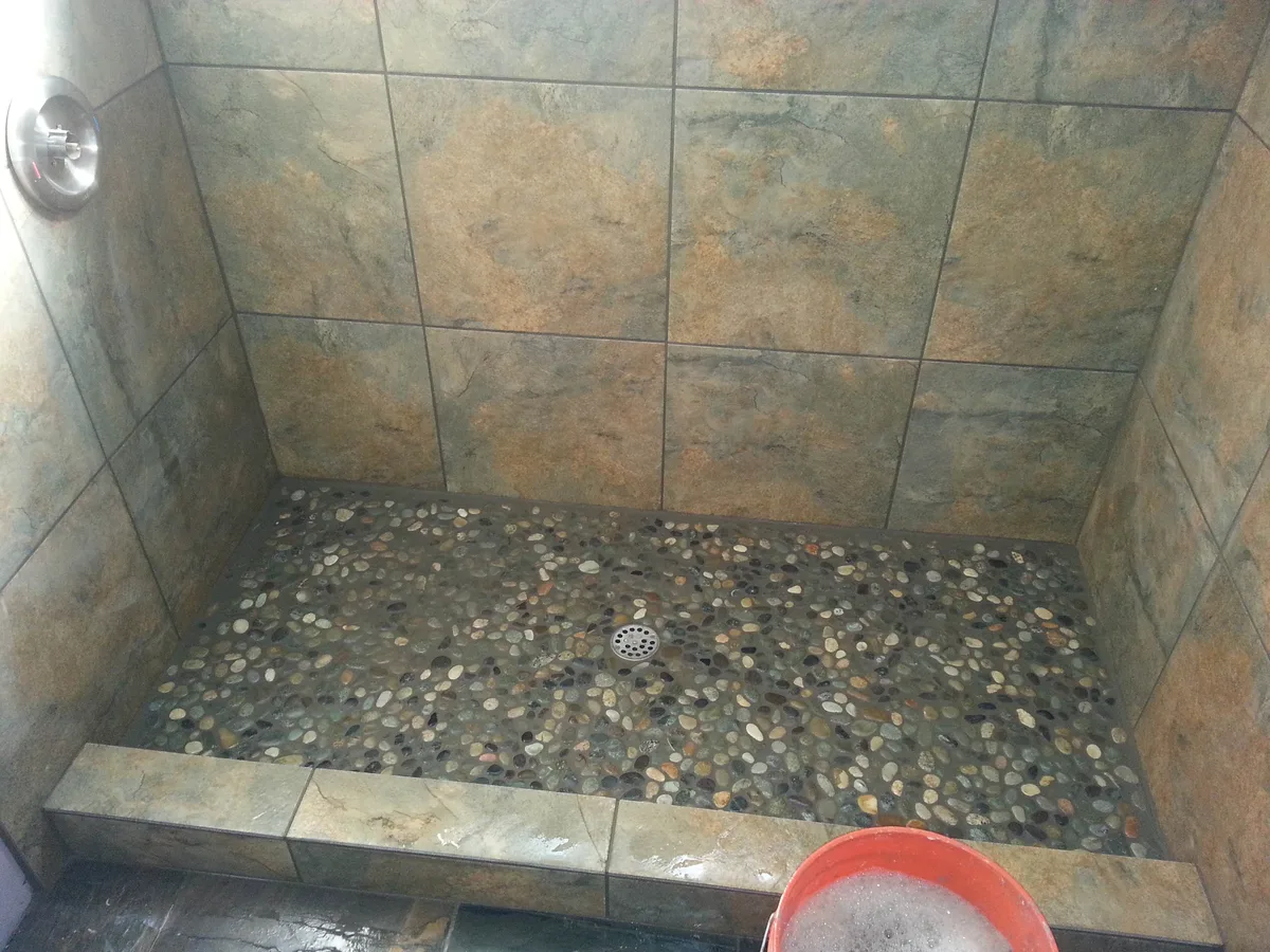 A finished pebble shower pan.